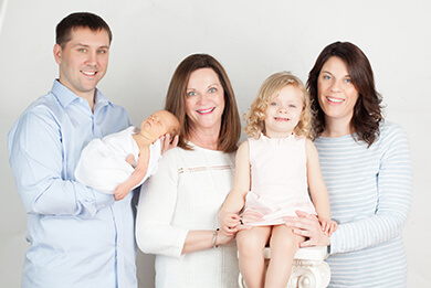 studio newborn family photo shoot pastel color airy